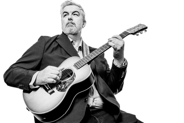 Black and white portrait of Chris Annable, guitarist photographed by Richard Mayle.
