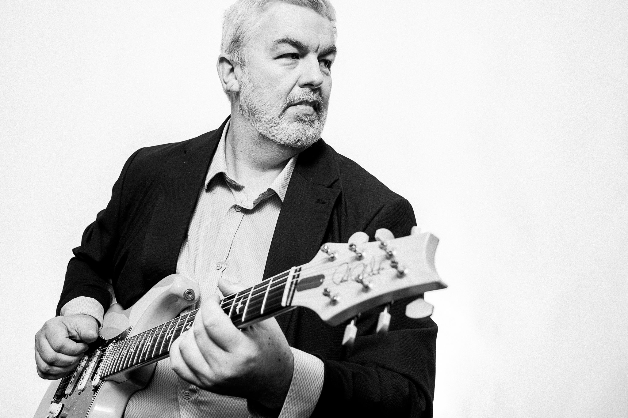 Black and white portrait of Chris Annable, guitarist photographed by Richard Mayle.