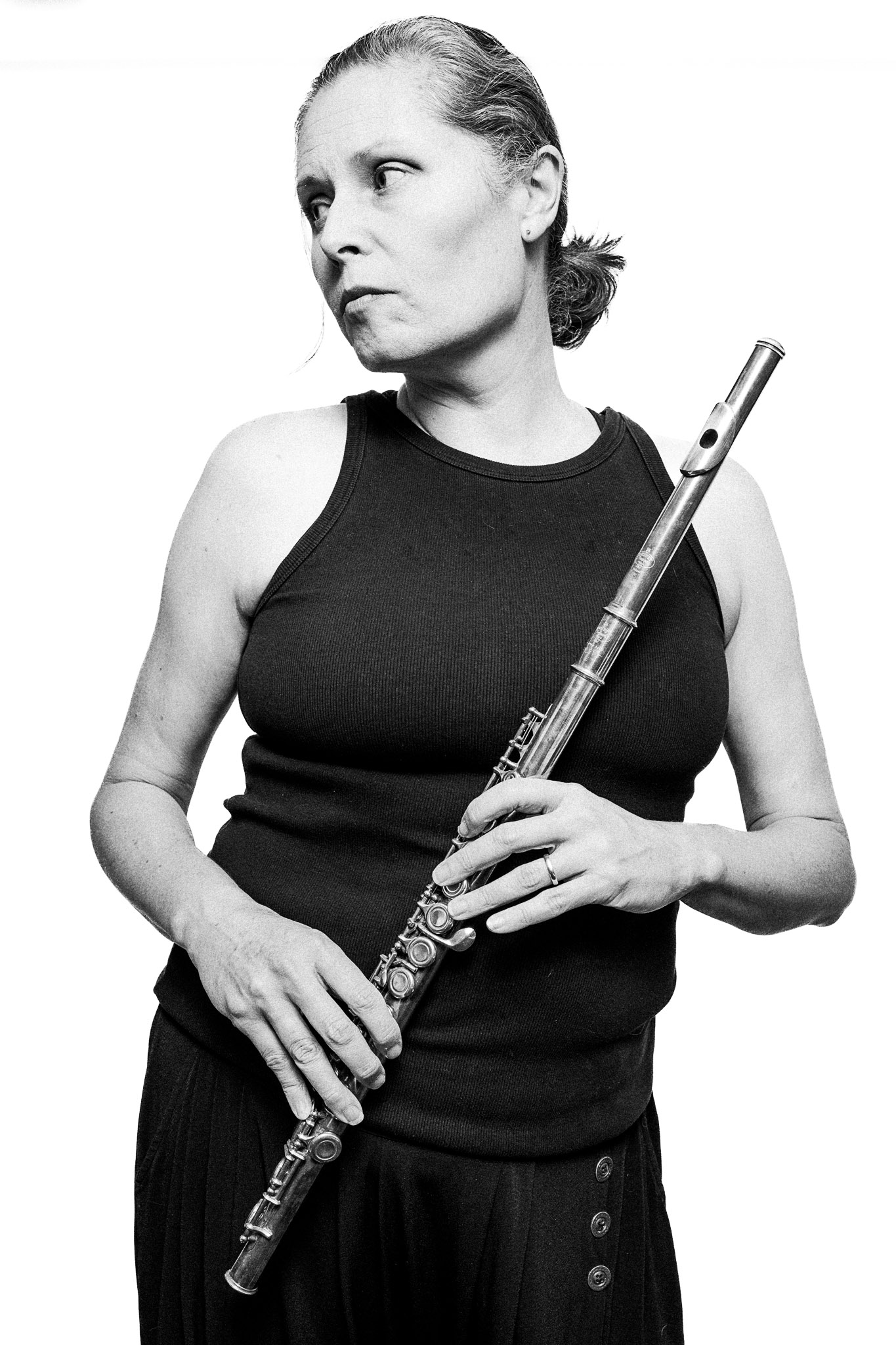 Black and white portrait of a musician holding a flute by Richard Mayle.