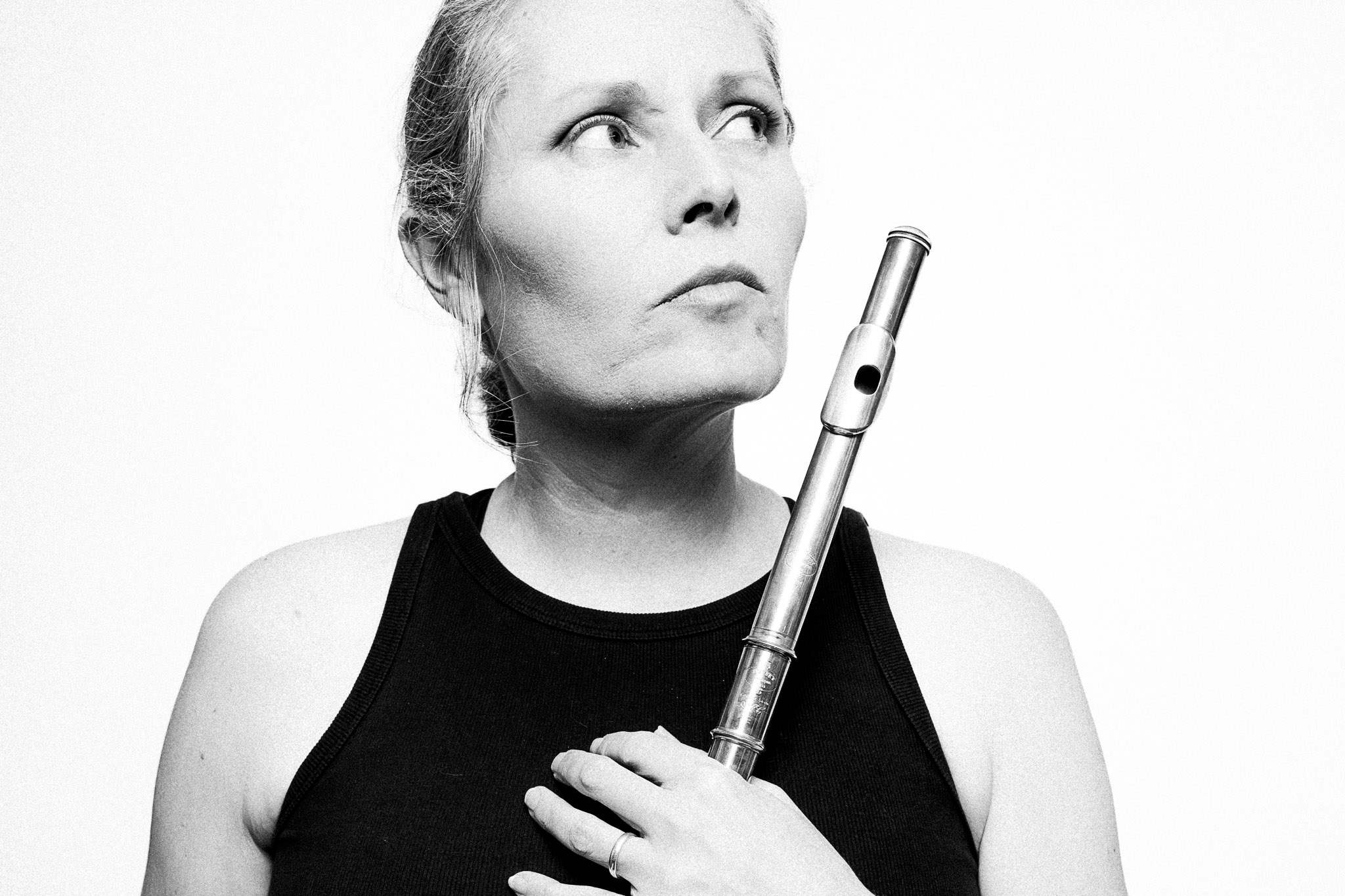 Black and white portrait of a musician holding a flute by Richard Mayle.