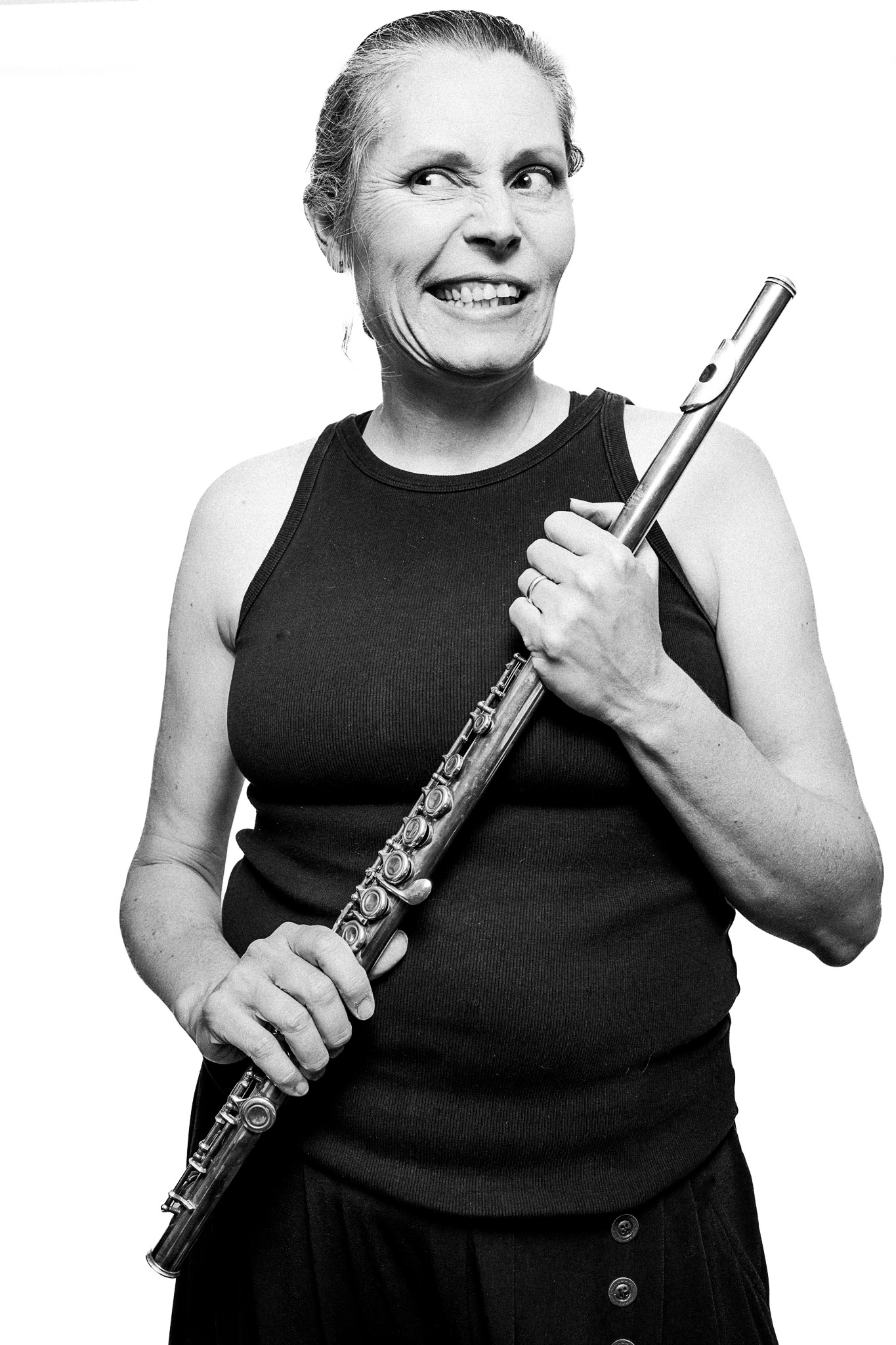 Black and white portrait of a musician holding a flute by Richard Mayle.
