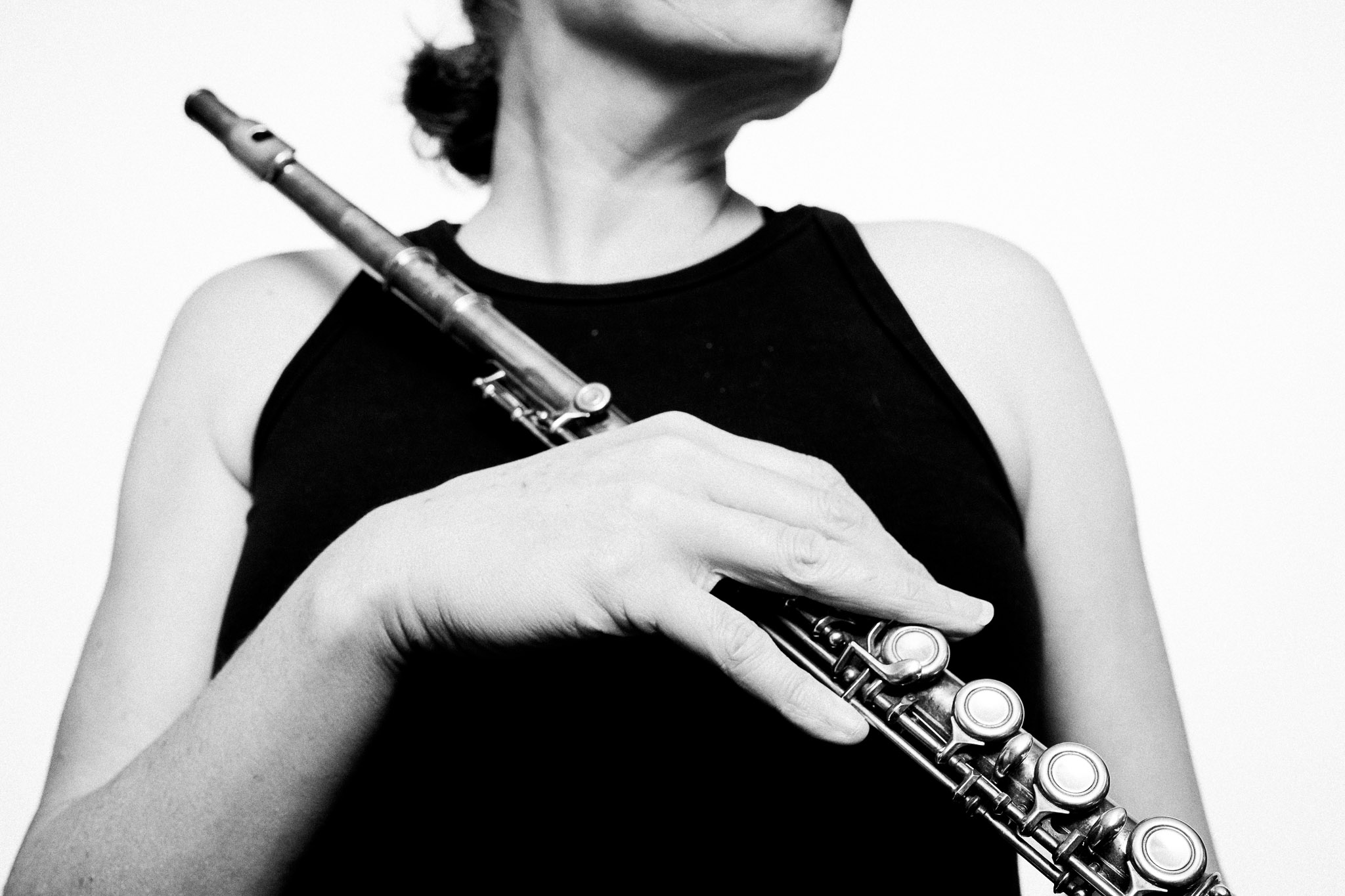Black and white portrait of a musician holding a flute by Richard Mayle.