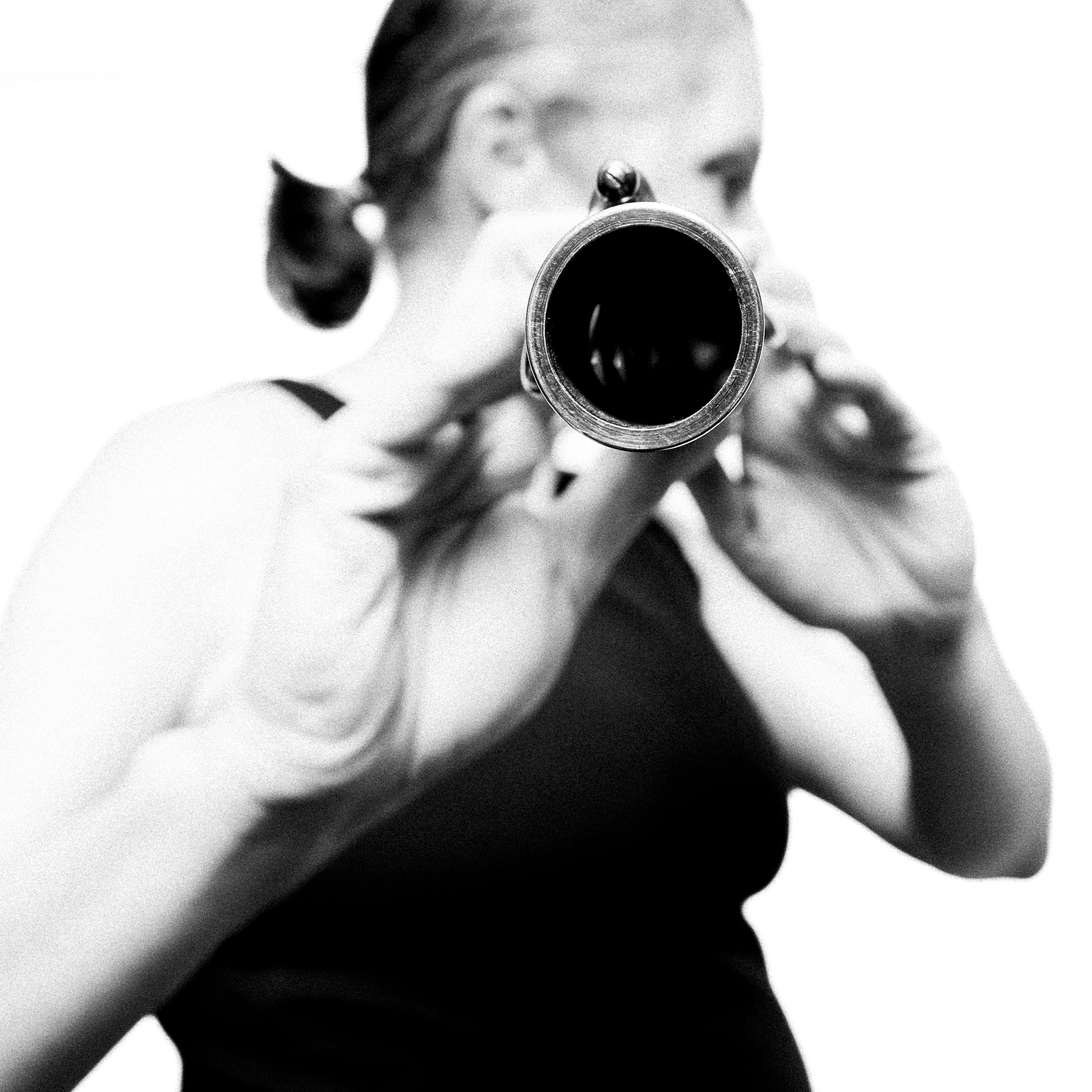 Black and white portrait of a musician holding a flute by Richard Mayle.